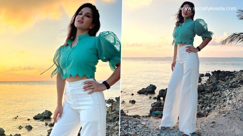 Sunny Leone Enjoys a Beautiful Sunset by the Sea, Poses in a Turquoise Top and Pants (View Pics)