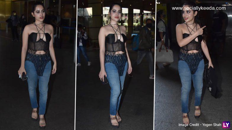 Urfi Javed Pairs a Black Mesh Bodycon Top With Blue Denims for Her Bizarre Airport Arrival (View Pics)