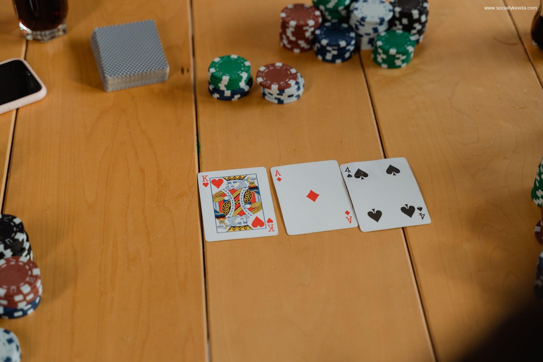 playing cards on brown wooden table